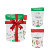 Load image into Gallery viewer, Image of Nomad hot Chocolate peppermint candy and gingerbread latte packed in the pouch bag 200g each and image of two hot chocolates wrapped in the red ribbon