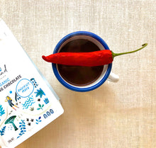 Load image into Gallery viewer, Organic and vegan drinking chocolate with Dominican cacao, hot drink in cup with chilli on top