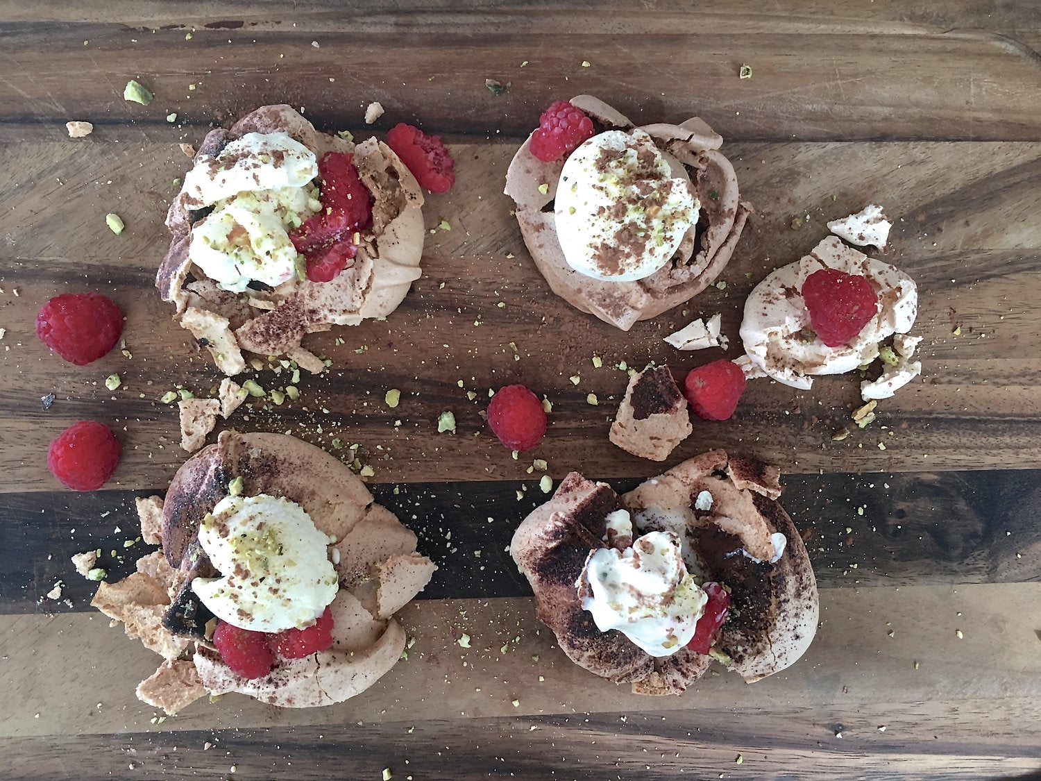 CHOCOLATE PAVLOVA WITH RASPBERRIES AND PISTACHIO