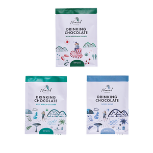 Three packages of Nomad Drinking Chocolate on a white background. Nomad Chocolate 3 Mini Hot chocolates  each 40g, West Africa 45% Dark, Bondi Blend, Peppermint Candy.
