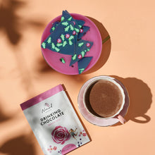 Load image into Gallery viewer, Image of Nomad chocolate bark with candy in the shape of green Christmas tree, cup of hot chocolate and Rose drinking chocolate 