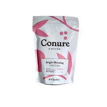 Load image into Gallery viewer, Image of Conure coffee Bright morning 250g front  white bag with pink illustrations 
