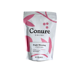 Image of Conure coffee Bright morning 250g front  white bag with pink illustrations 