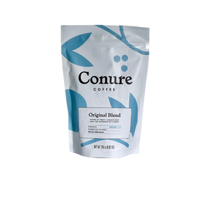 Conure coffee beans in 250g bag. Original blend  in white bag with blue illustration 