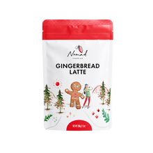 Load image into Gallery viewer, A 200g stand-up pouch of Nomad Gourmet Gingerbread Latte, featuring a white body with a red top seal, black text, and festive illustrations of a gingerbread man, trees, and a snowman.