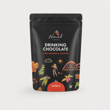 Load image into Gallery viewer, A black stand-up pouch of Nomad Chocolate Drinking Chocolate with Australia Natives, featuring colorful illustrations of Australian flora and fauna on a light gray background.