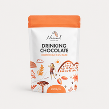 Load image into Gallery viewer, Nomad Chocolates Drinking Chocolate pouch in Dominican 55% Dark, featuring a white and orange stand-up package with illustrated tropical and outdoor motifs.