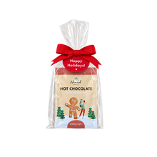 Load image into Gallery viewer, A packaged gift bag of Nomad Hot Chocolate Gingerbread cookies, wrapped in clear cellophane with a red bow and a red 'Happy Holidays!' tag, on a white background.