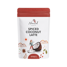 Load image into Gallery viewer, A stand-up pouch of Nomad Chocolate Spiced Coconut Latte on a plain white background. The package has a red resealable top, a white body, and an illustrated front label featuring a woman, a coconut, mountains, and small orange decorative motifs.