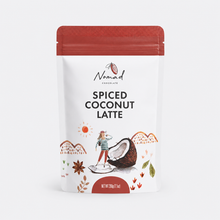 Load image into Gallery viewer, A stand-up pouch of Nomad Chocolates Spiced Coconut Latte on a clean white background. The packaging features a white body with a textured red top, and an illustration of a person standing on a cracked coconut with decorative orange and green accents.
