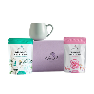 Nomad HOT CHOCOLATE AND MUG GIFT containing gift box in purple, nomad drinking chocolate West Africa 45% dark 200g, robert gordon cup in green and nomad drinking chocolate rose 200g. all dairy free, vegan and gluten free hot chocolates