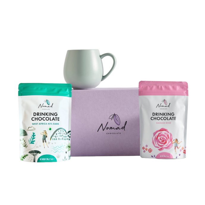 Nomad HOT CHOCOLATE AND MUG GIFT containing gift box in purple, nomad drinking chocolate West Africa 45% dark 200g, robert gordon cup in green and nomad drinking chocolate rose 200g. all dairy free, vegan and gluten free hot chocolates