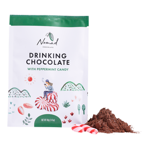 Nomad Drinking Chocolate with Peppermint Candy bag with cacao and candy candy next to bag