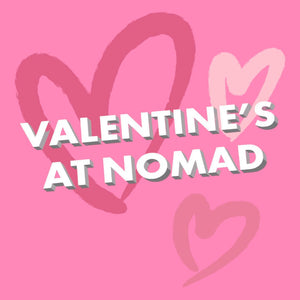Nomad chocolate gift card for valentine's day with pink harts at the back of the card.