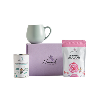 Nomad HOT CHOCOLATE AND MUG GIFT containing gift box in purple, nomad drinking chocolate west Africa 45% dark 200g, robert gordon cup in green and nomad drinking chocolate rose 200g. all dairy free, vegan and gluten free hot chocolates