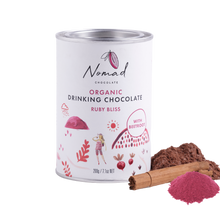 Load image into Gallery viewer, Organic Nomad Chocolate Ruby Bliss with Spices and beetroot powder next to the tin.