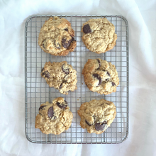 Load image into Gallery viewer, Nomad chocolate and oatmeal cookies on the cooling rack