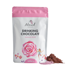 Load image into Gallery viewer, Nomad Chocolate with Damask Rose white bag with cacao and rose dust powder next to bag