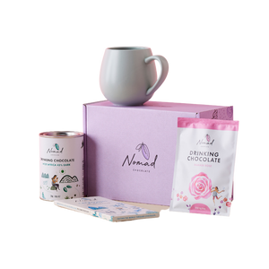 Pink Gift Box with Robert Gordon Hug mug on top, Nomad Chocolate WEST AFRICA tin, 40g Drinking Chocolate with Rose and Chocolate Bar with Cocoa Nibs and Salt next to box