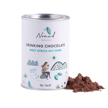Load image into Gallery viewer, Nomad Hot Chocolate West Africa 45% Dark 200g white tin with cocoa powder next to the  tin.